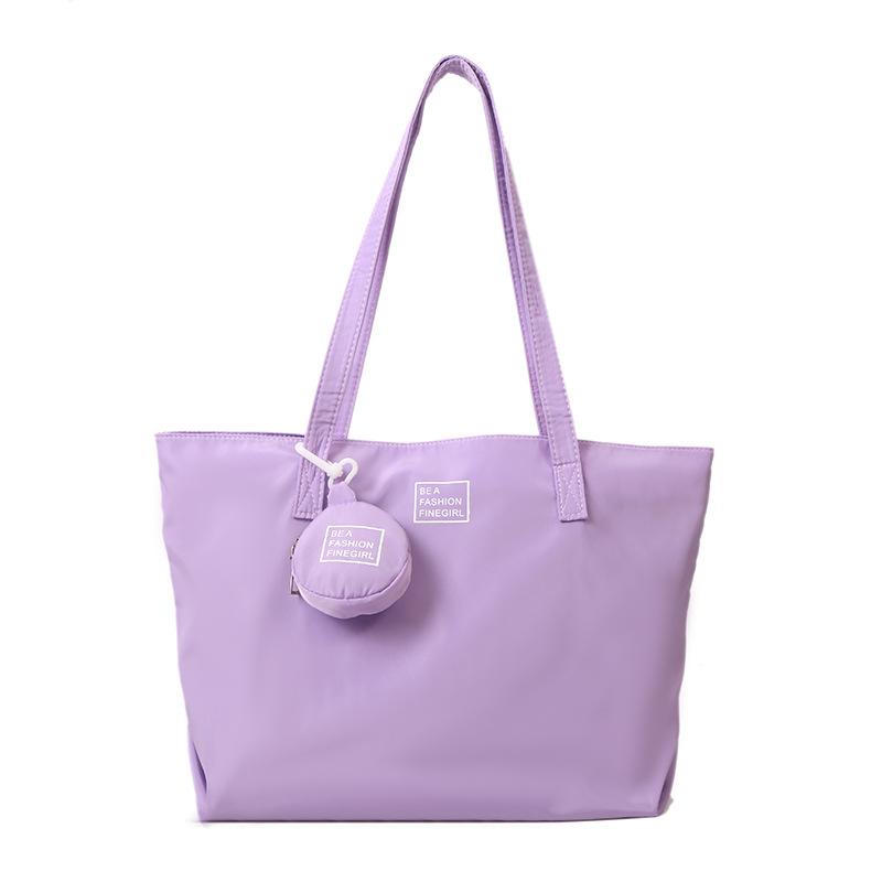 

Premium commuter big bag women s 2025 new large-capacity bag fashionable portable tote bag nylon shoulder bag фіолетовий