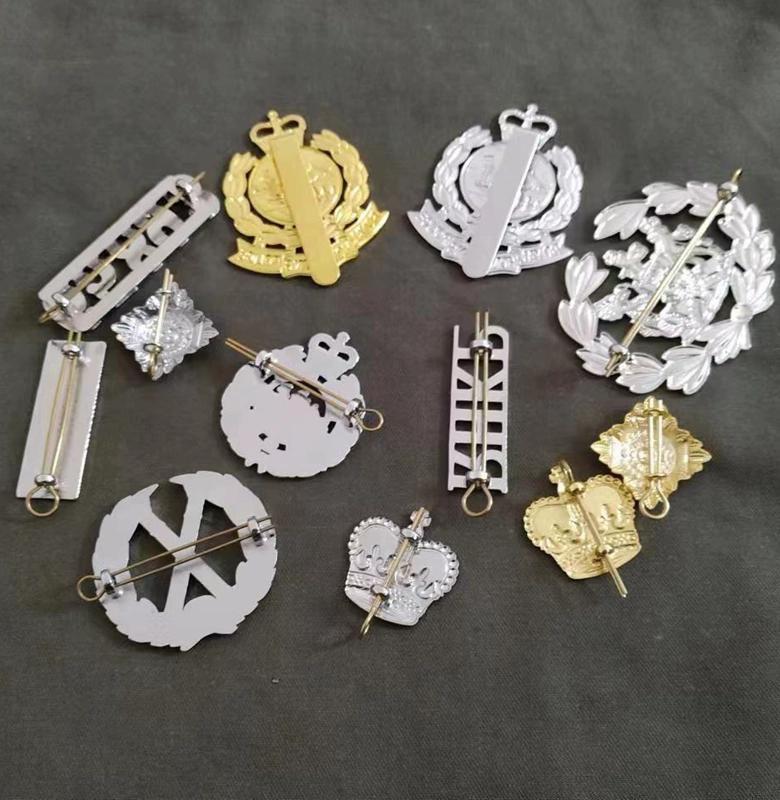 Metallabzeichen-Bekleidungszubehör wird ebenfalls ausgemustert