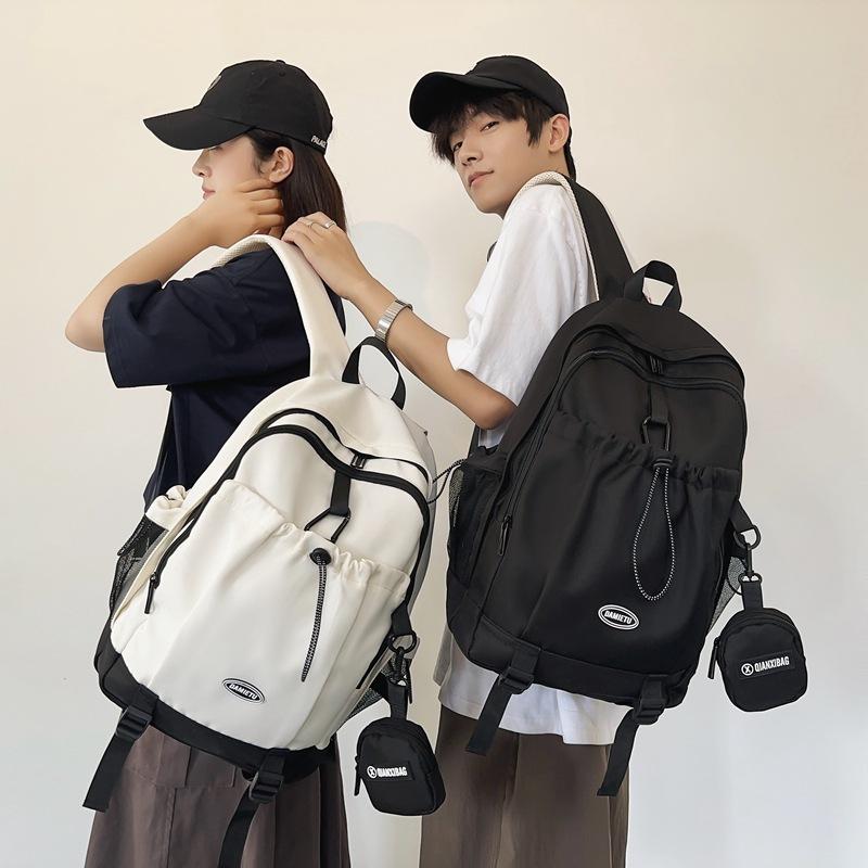 Casual backpack backpack new large-capacity Japanese and Korean boys college students solid color schoolbag