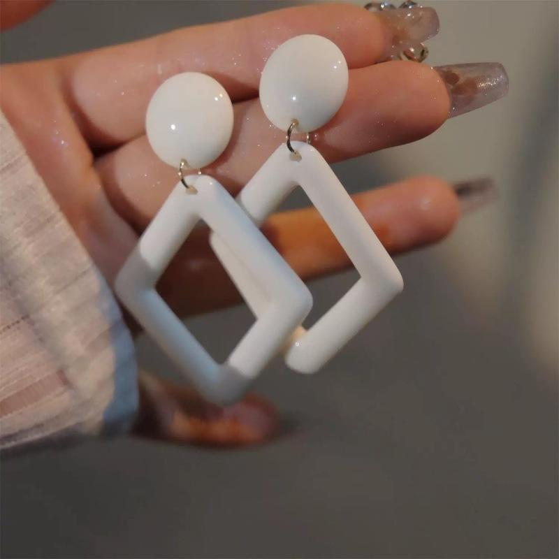 French personalized milky white retro earrings simple hollow rhombus geometric stud earrings women's fashion versatile ear jewelry earrings