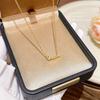 Elegant Gold Fishbone Necklace - Fashionable Clavicle Chain for Women with Stylish Fishbone Pendant.