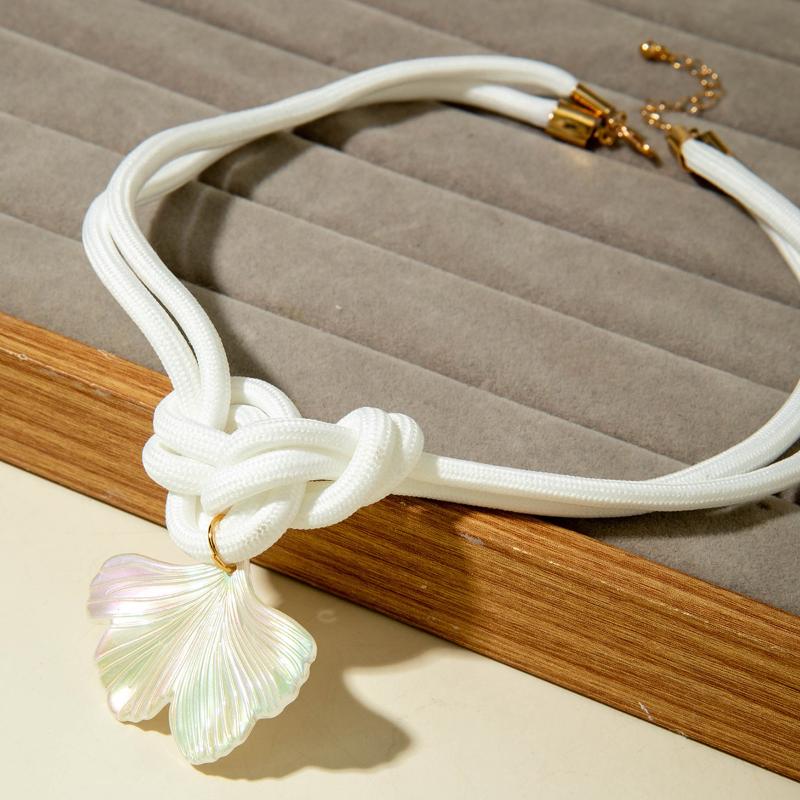 A Unique Knotted Design Necklace With Leaves Starfish And Scallops A Simple Drawstring Pendant Necklace With A Bow And Pearls
