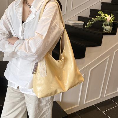 Bolsa de ombro casual simples de grande capacidade feminina 2025 primavera nova tendência moda design de nicho bolsa tote para deslocamento