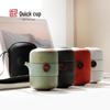 Compact Japanese Kung Fu Tea Set: Black Ceramic Travel Pot with Two Cups and Portable Bag