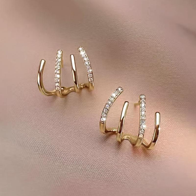 

Korean Rake-Shaped Zircon Stud Earrings - Niche Luxury Design, Four-Prong Versatile Ear Jewelry.