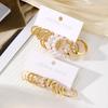European and American-style, subtly luxurious, fashionable twisted-design earrings with diamond and pearl embellishments11New metal geometric