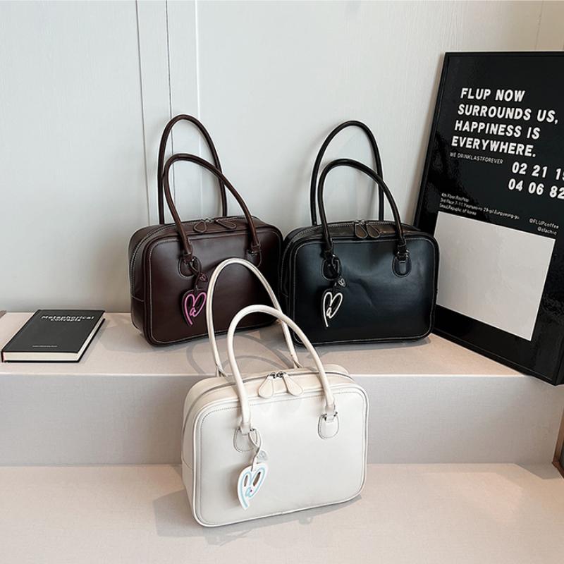 Nové podzimní dámské tašky s vysokou kapacitou a pokročilou texturou, jednobarevné, s dobrým vzhledem, jednoduché univerzální tašky přes rameno