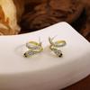 Exquisite Diamond-Encrusted Silver Snake Earrings – Luxurious, Unique Design with a Modern Style.