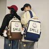 Schoolbag new student backpack casual large-capacity computer bag Korean version cute smiley face couple schoolbag manufacturer wholesale