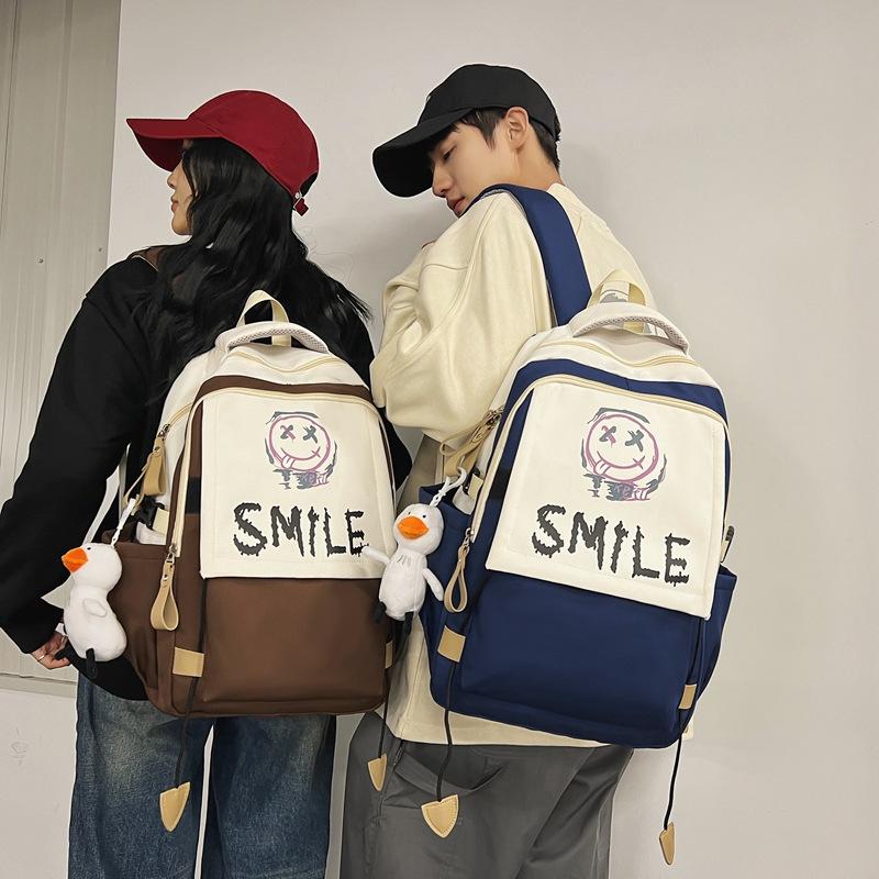 Schoolbag new student backpack casual large-capacity computer bag Korean version cute smiley face couple schoolbag manufacturer wholesale