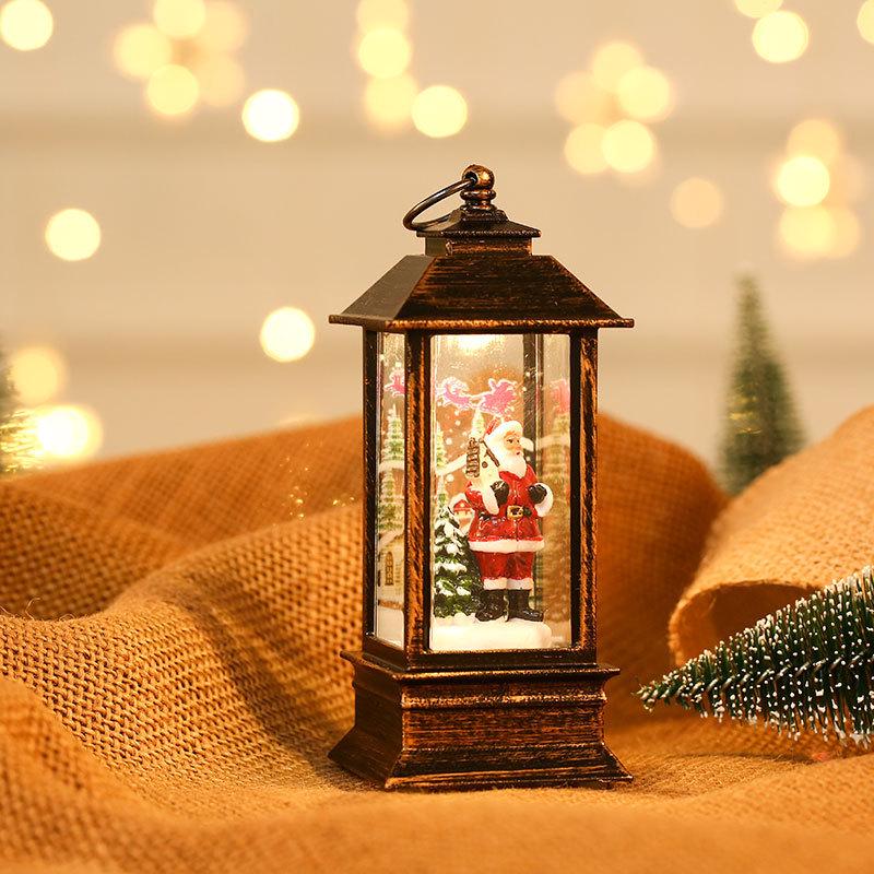 Leuchtender Schneemann und Öllampe in gebürstetem Gold als Weihnachtsdekoration