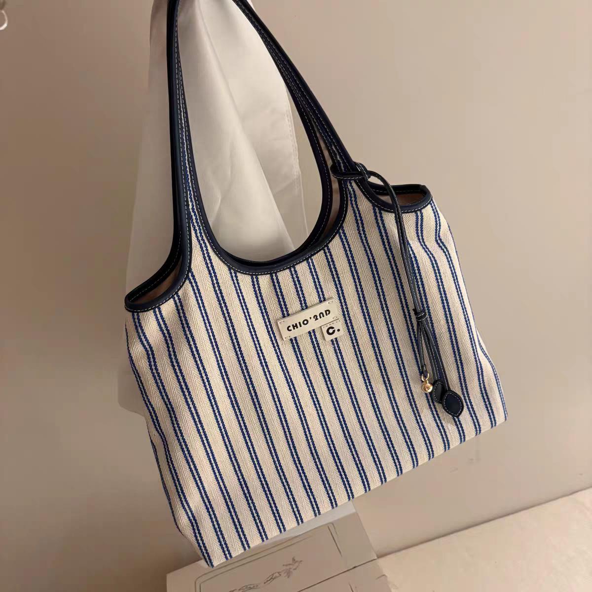 

Nanfeng versatile trend mint whisper handbag women s 2025 new one-shoulder crossbody bag niche commuter Kelly bag