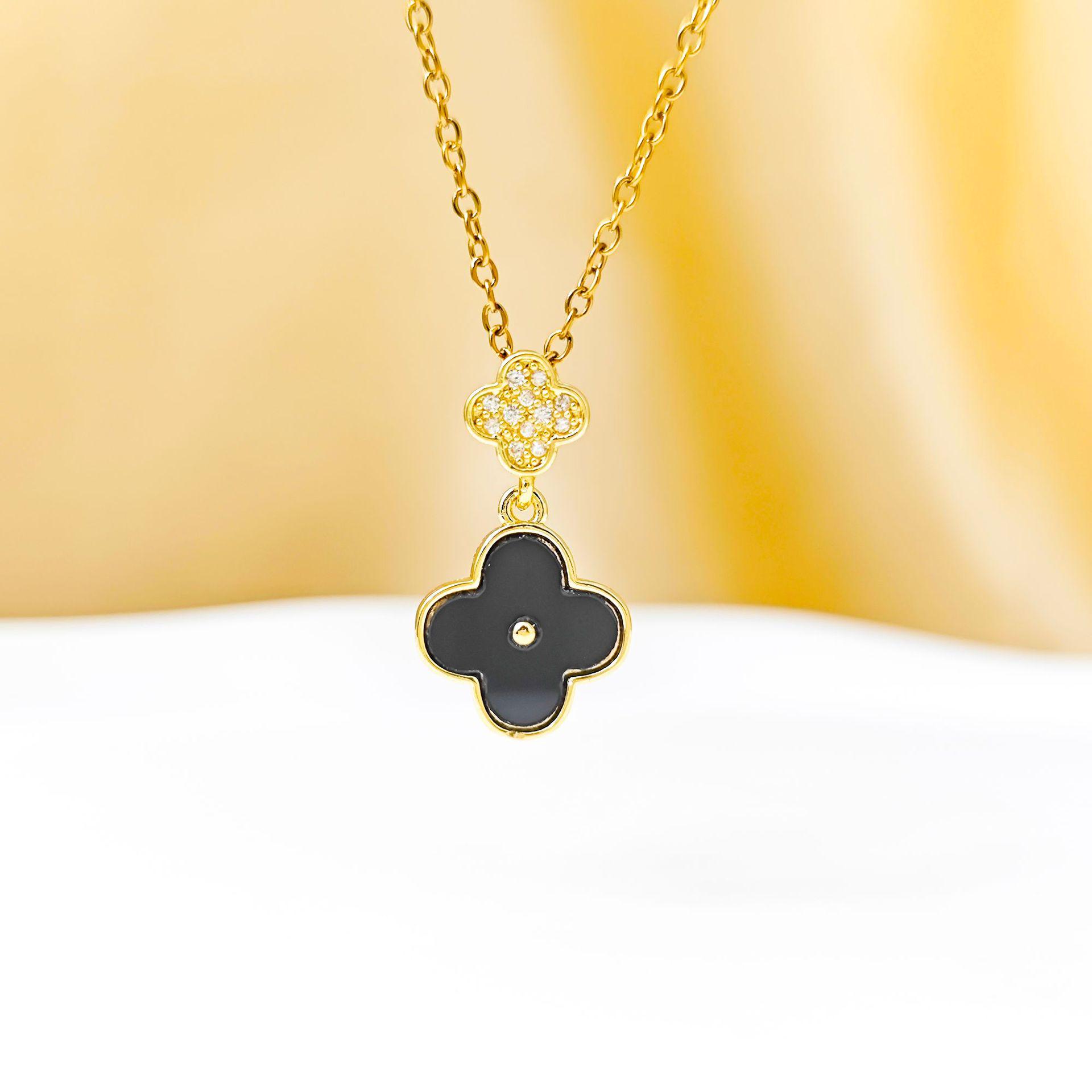 Stylish Korean Four-Leaf Clover Pendant with Micro-Inlaid Zircon and Tassel on a Titanium Steel Clavicle Chain
