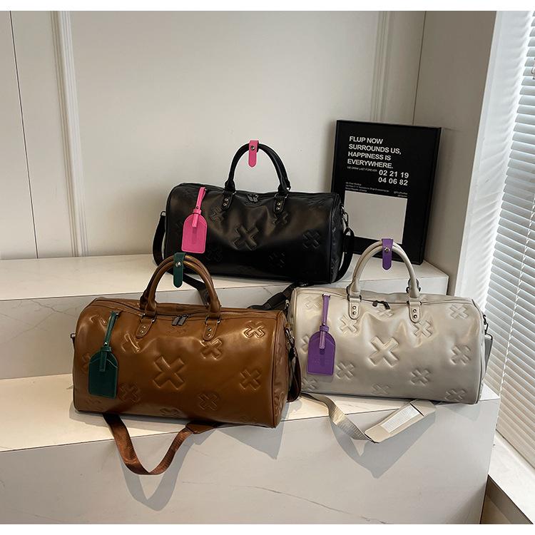 Fashionable PU Embossed Women's Handheld Travel Bag - Large Capacity Carry-on with Wet/Dry Separation for Business and Fitness.