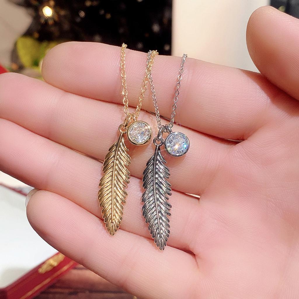 Vintage Feather Pendant Necklace with Sparkling Round Stone Accent Elegant Nature Inspired Jewelry for Women