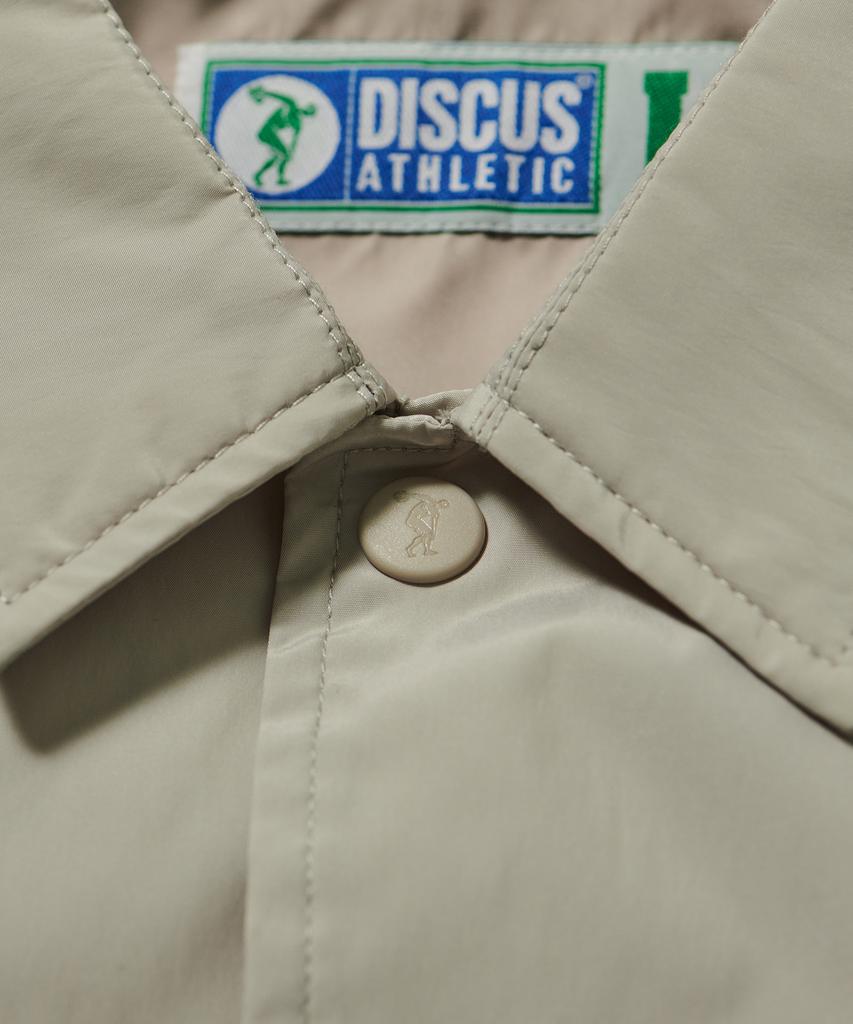 Discus Athletic Letter Logo Coach Jacket Sand Beige