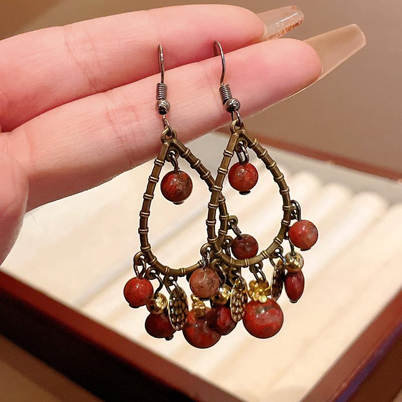 

Water drop tassel earrings New Chinese retro temperament High-end ear hook Niche fashion design earrings Women