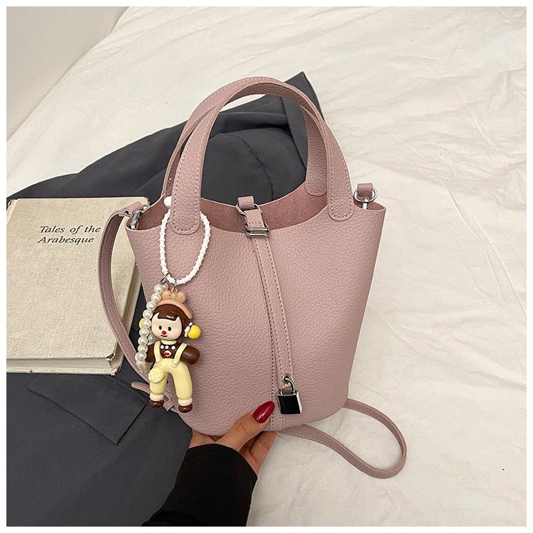 Beliebte tragbare Eimertasche Damen Frühling und Sommer 2025 Neue einfache und lässige Umhängetasche Modische Umhängetasche