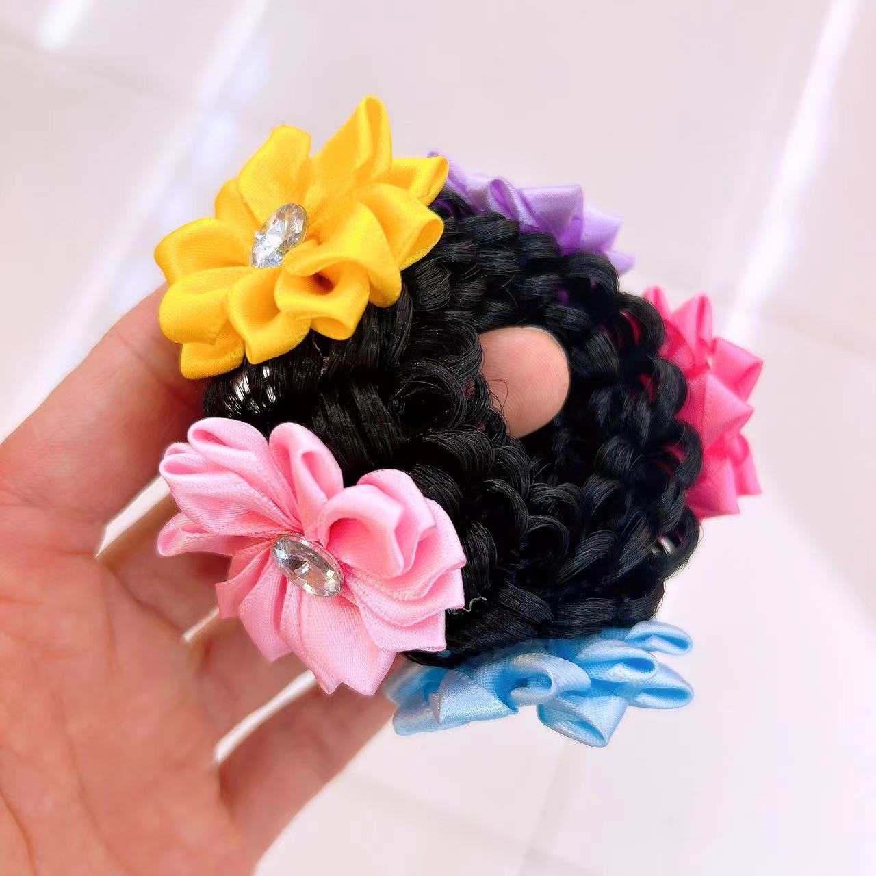 

Children s festive hair accessory, a large red flower hairband for kids, suitable for celebratory updo hairstyles.