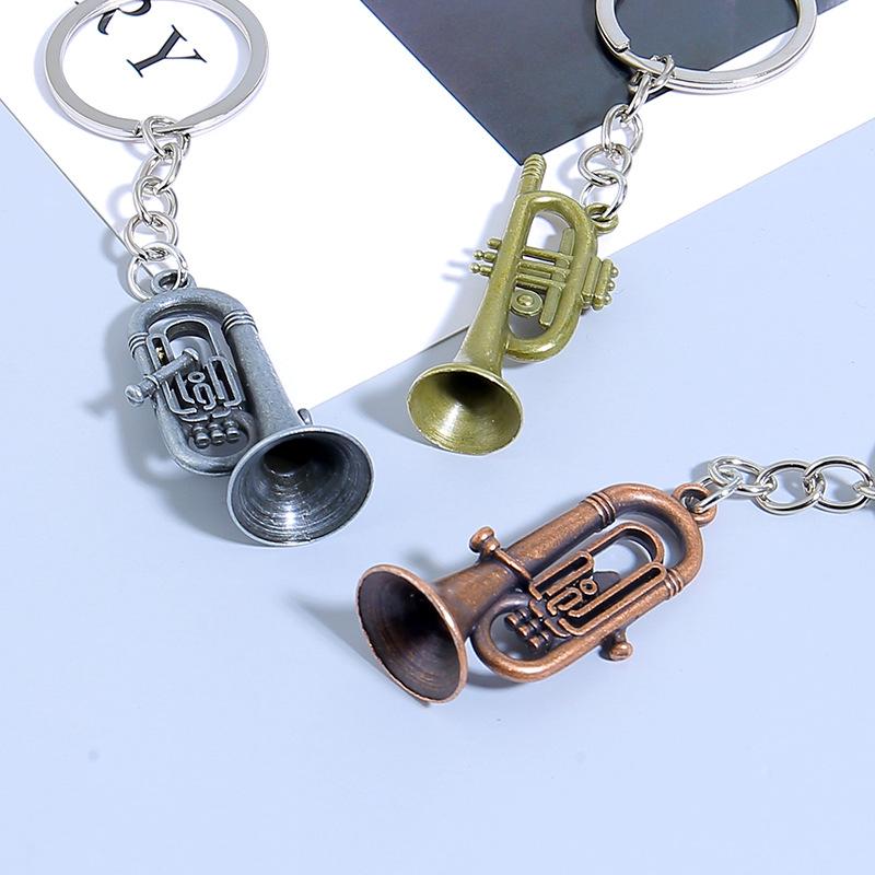 Mini nástroj Saxofon Přívěsek na klíče do auta Mini hudební nástroj Kovový kroužek na klíče Příslušenství Přívěsek na tašku Dárky na hudební festival