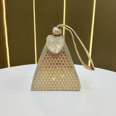 The Lady Held The Triangular Hand-held Dinner Bag Hand In Hand, Carrying A Small, Fashionable Handbag