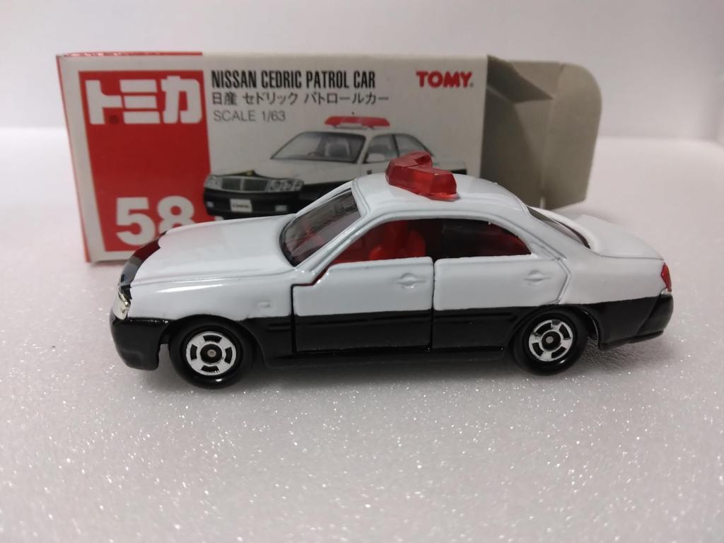 Tomica Nr. 58 Nissan Cedric Patruljebil, 163 skala
