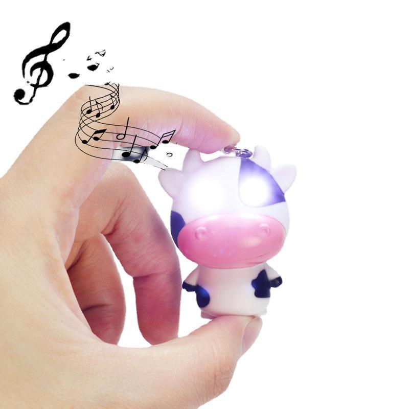 Luminous Cow Pendant Keychain: Sound & Light Accessory for Phones, Backpacks, and Luggage