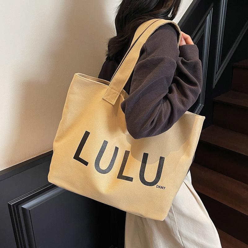 2025 autumn new portable shoulder canvas bag fashionable simple letter trend commuter large capacity shoulder bag