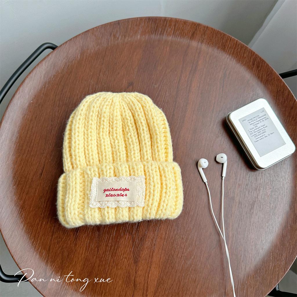 Neue Spitze Etikett Kinder Wollmütze Nuojiji Student Herbst und Winter Neu Warm und Vielseitig Ohrenschutz Strickmütze