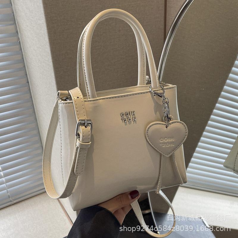 Popular foreign niche design bag women's 2025 new portable bucket bag fashionable commuter shoulder crossbody bag