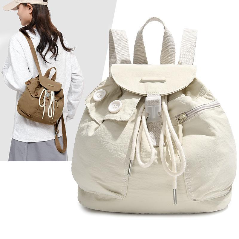 Schoolbag1011 new Korean ins women's niche design lightweight pocket button drawstring backpack outdoor nylon