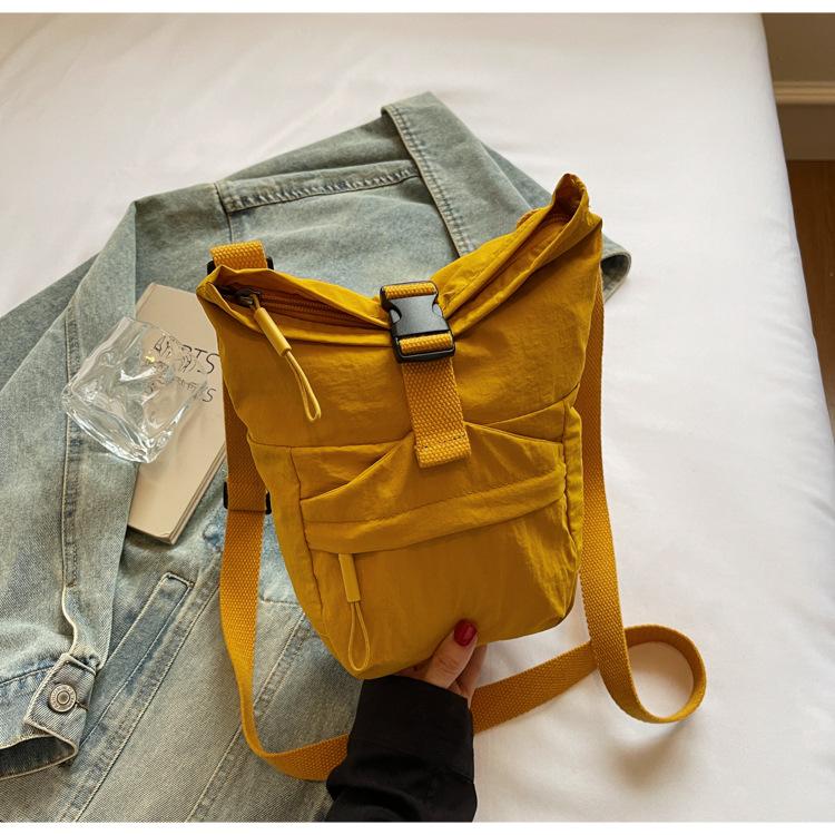 Japan and Korea casual small satchel women's 2025 new lightweight canvas mobile phone collar wallet niche design shoulder messenger bag