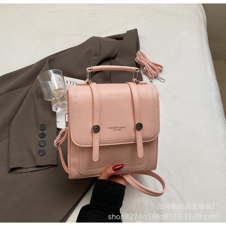 

Japanese new girls casual simple spring backpack new commuter niche design light messenger bag розовый