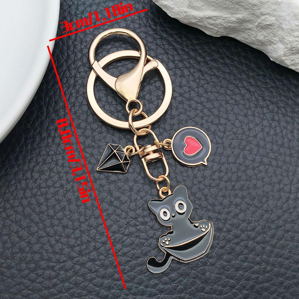 Well-Behaved Black Cat Zinc Alloy Keychain: Cute Drip Oil Cartoon Pendant for Backpacks