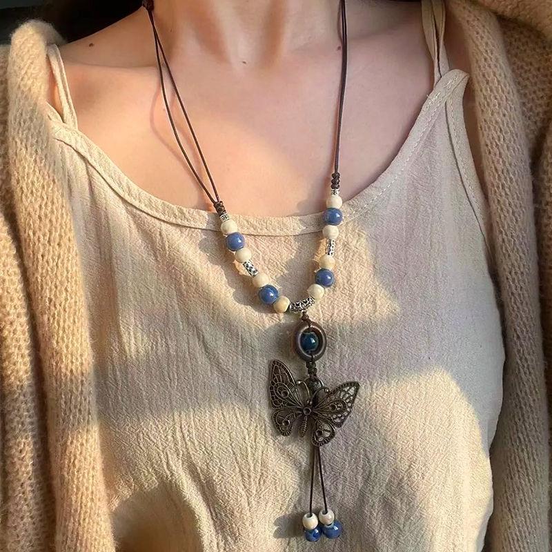 Retro pendant, ethnic style ceramic butterfly bell necklace, women's new trendy long sweater chain with accessories