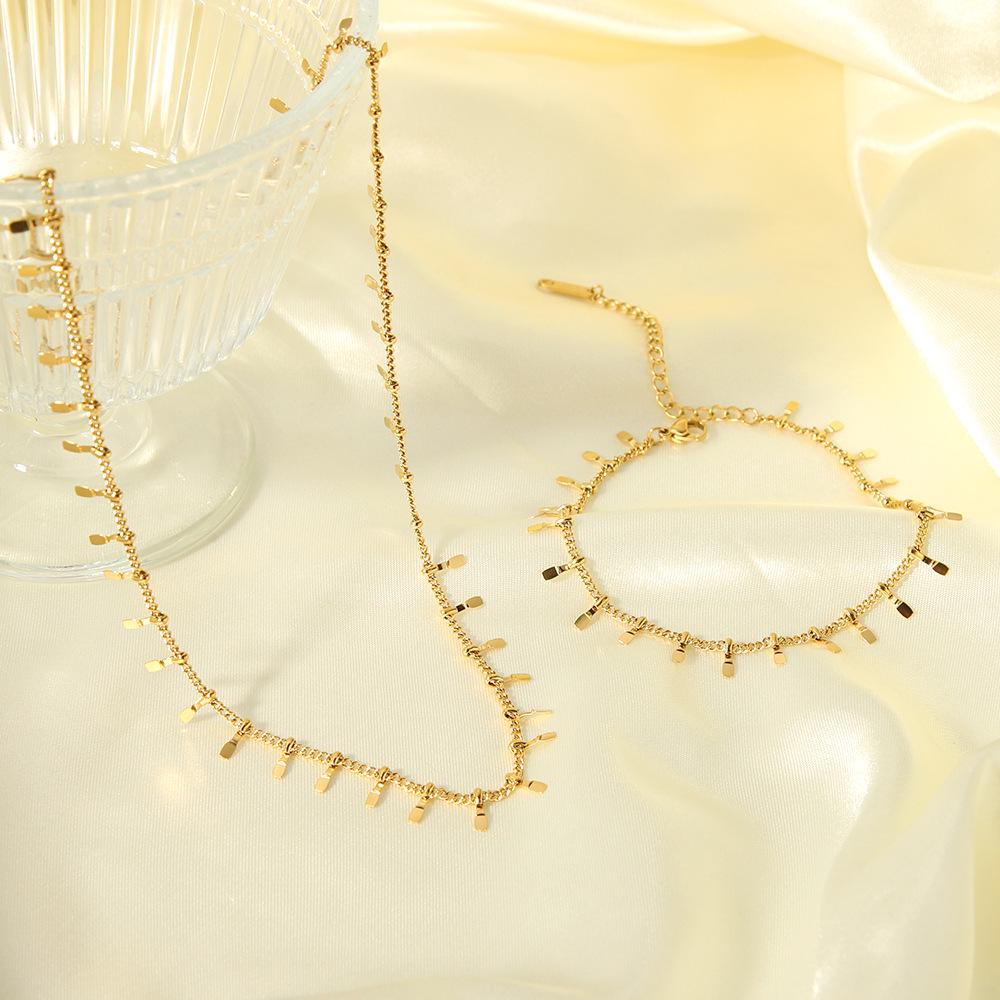 High-End European & American Tassel Choker: 18K Gold Stainless Steel Necklace & Clavicle Chain Bracelet for Women.