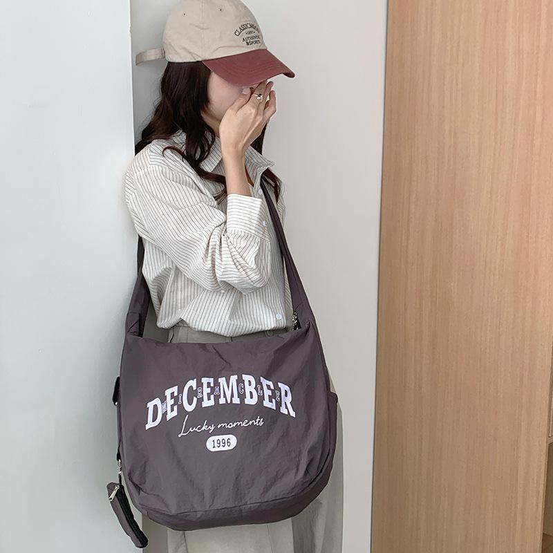 

New spring bag model: nyl casual style large crossbody bag, simple and versatile, suitable for work and commuting синьо сірого кольору