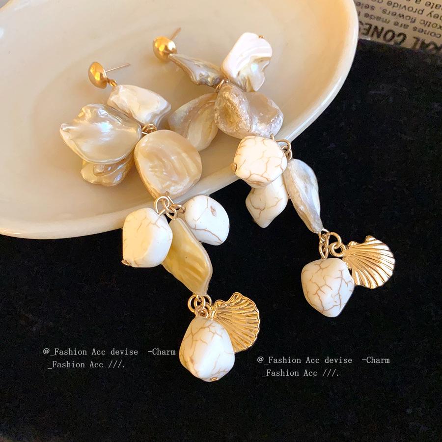 Silver needle irregular geometric shell fringed earrings European and American fashion simple earrings holiday style niche earrings
