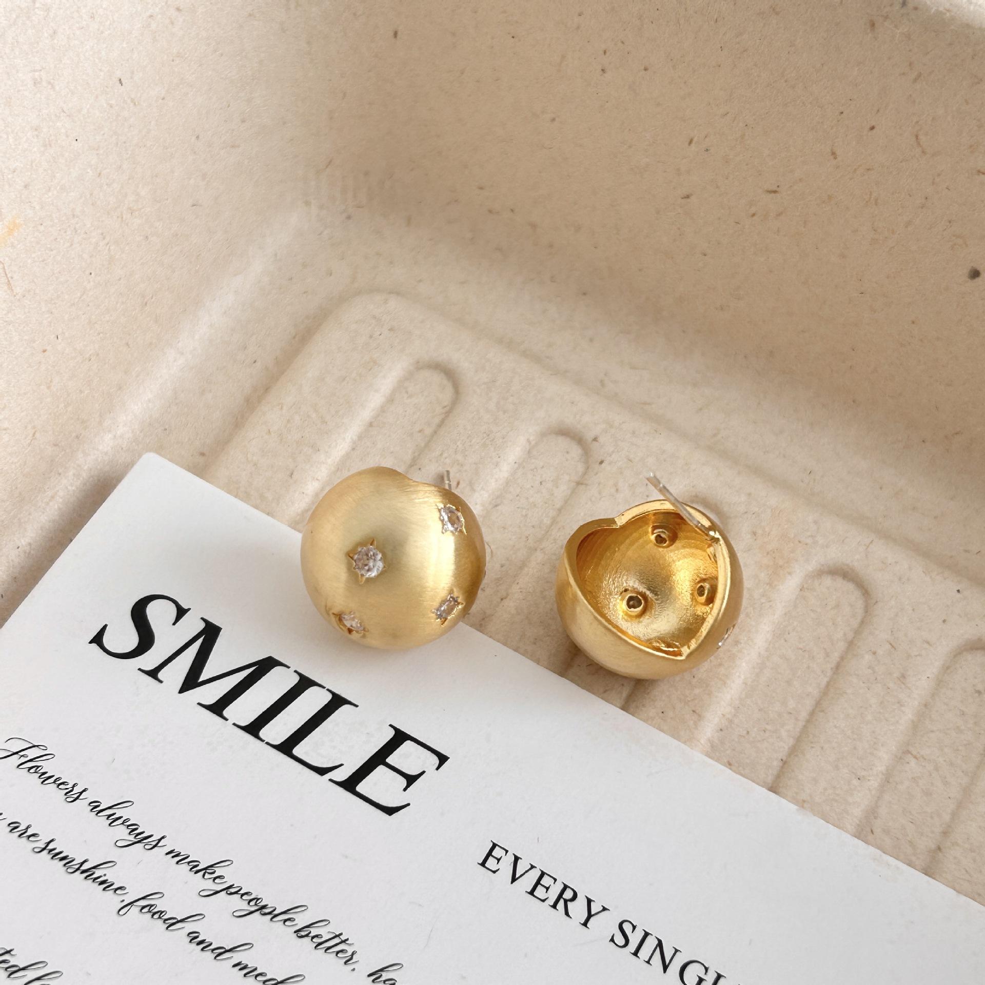 Metal ball brushed stud earrings niche unique star earrings 2026 burst diamond earrings