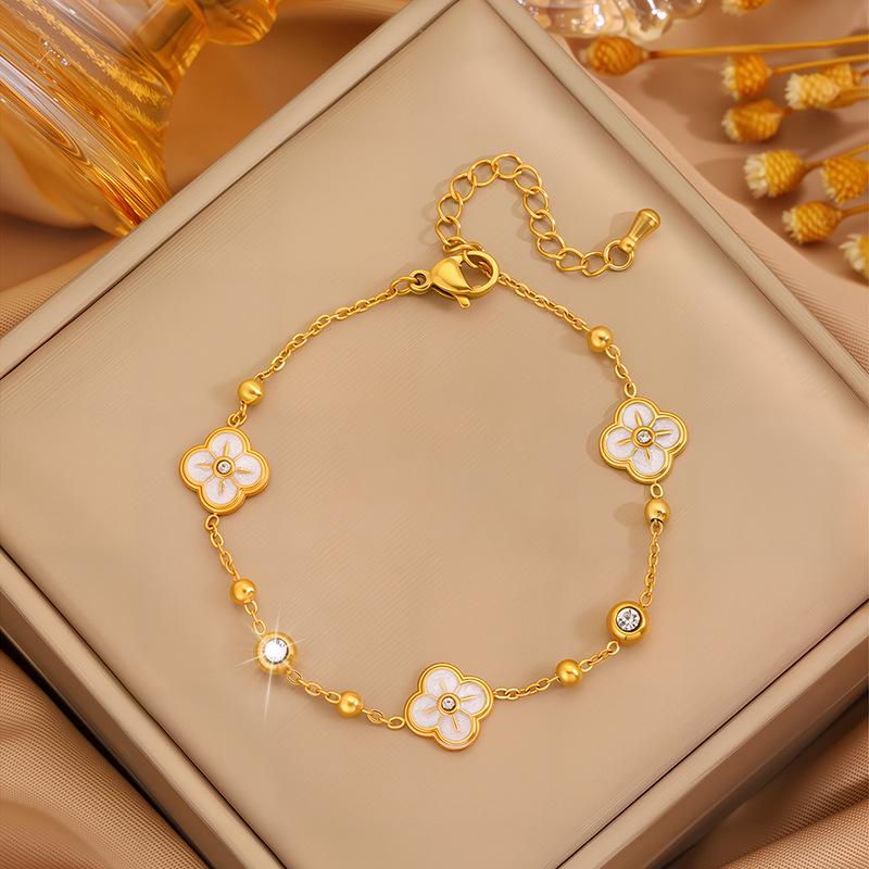 Elegant Women's Titanium Steel Bracelet with Diamond-Embedded Four-Leaf Clover and Eight-Pointed Star Design