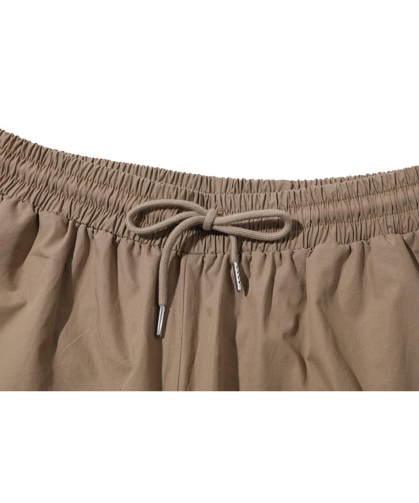 CPGN STUDIO Weite Cargohosen Beige