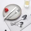 40pcs Elegant Silver Cutlery Set Features Stainless Steel Openwork Handles and Includes Forks, Spoons, and Knives. Perfect for W