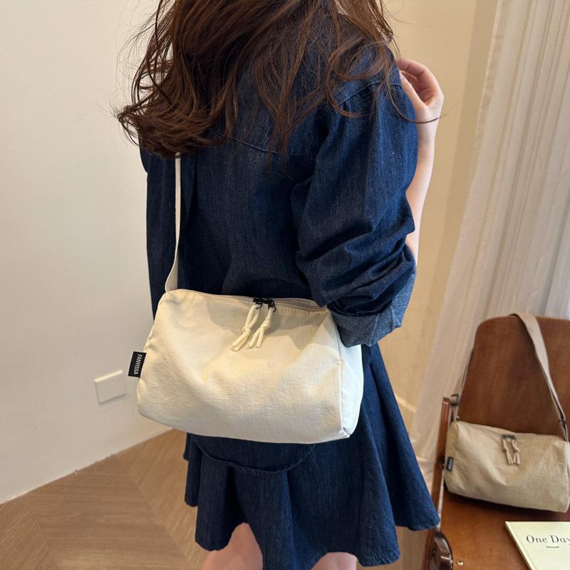 

Casual large-capacity nylon canvas bag women s new fashion shoulder bag versatile broadband messenger pillow bag слоновая кость