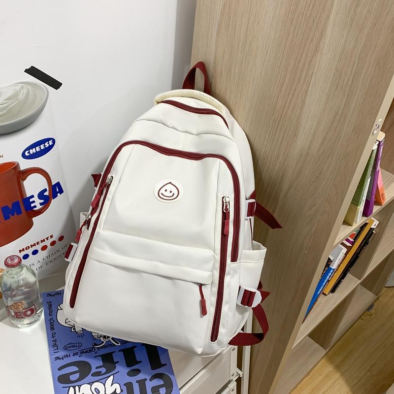 Schoolbag student schoolbag smiley face printing contrasting color large-capacity backpack Korean version Chinese college students commuting 