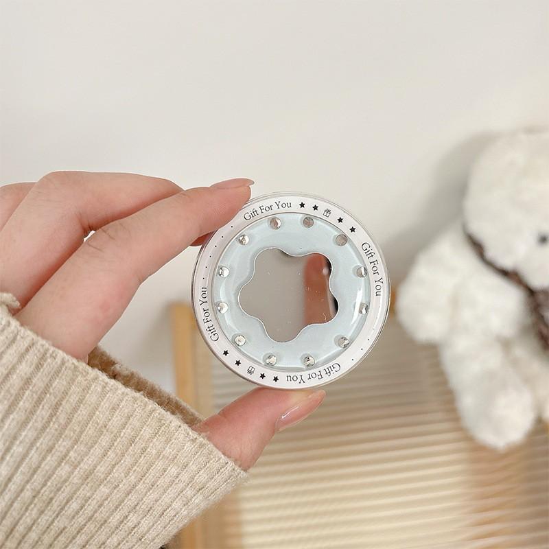 

Flower Shaped Small Mirror Solid Color Mobile Phone Airbag Holder Magnetic Suction Simple Folding Ring Cross-border Wholesale Internet Famous Gift
