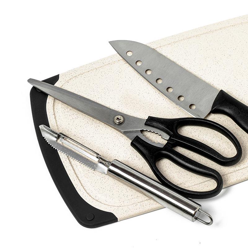 Portable Outdoor Cookware Set: Stainless Steel Cutlery, Storage Bag, and Cutting Board for Camping and Picnics.