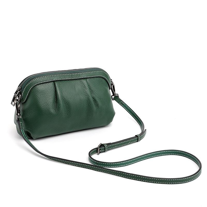 The first layer of cowhide small bag, the new versatile shoulder bag, simple pleated bag, messenger bag.