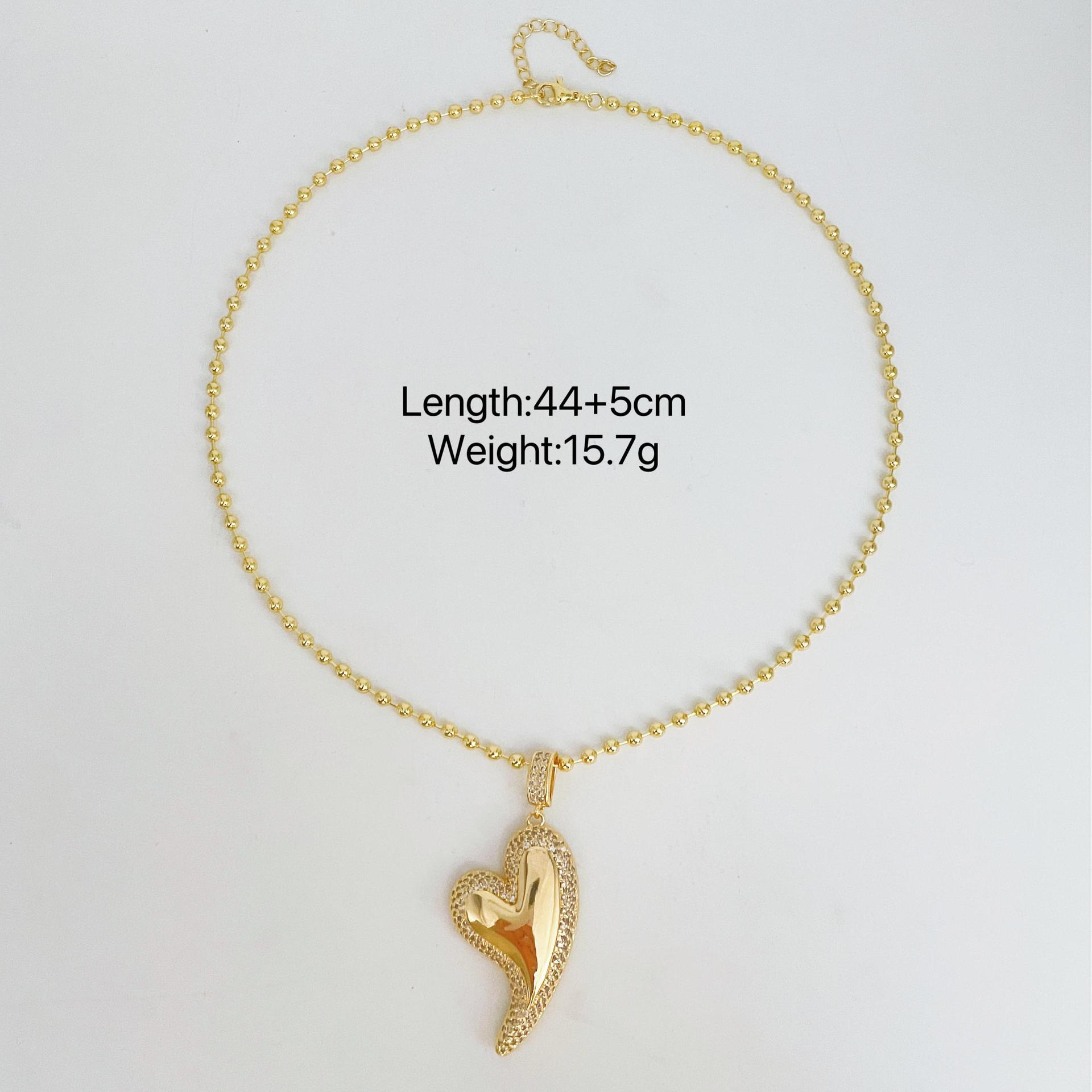 

Ожерелье Женская мода Любовь Бриллианты Тенденция Модный кулон Персиковое сердце Модный темперамент Ожерелье в форме сердца золотой