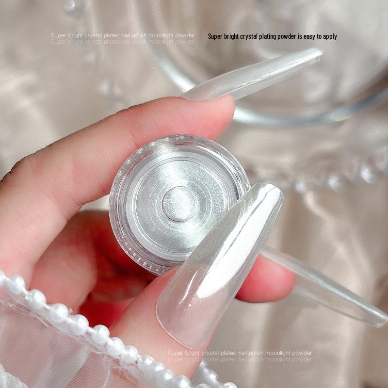 Aurora Nail Art Powder: Upgraded Crystal Coating with White Magic Mirror Effect for Easy Application and Super Bright Silver Finish.