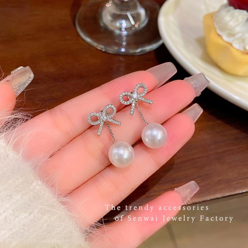 

Micro-inlaid zircon bow pearl earrings femininity rear-hanging stud earrings Korean version of the new earrings